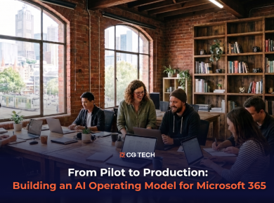 A team of professionals collaborating on laptops around a shared table, representing how businesses build an AI operating model for Microsoft 365.