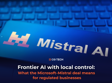 Mistral AI logo on a smartphone screen resting on a keyboard, illustrating the Microsoft–Mistral partnership for CG TECH's article on frontier AI and data control for regulated businesses.